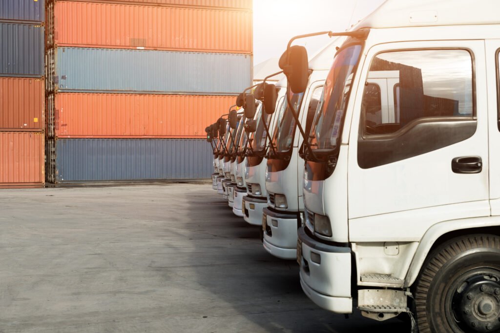 Container truck in depot at port. Logistics import export background and transport industry concept.
